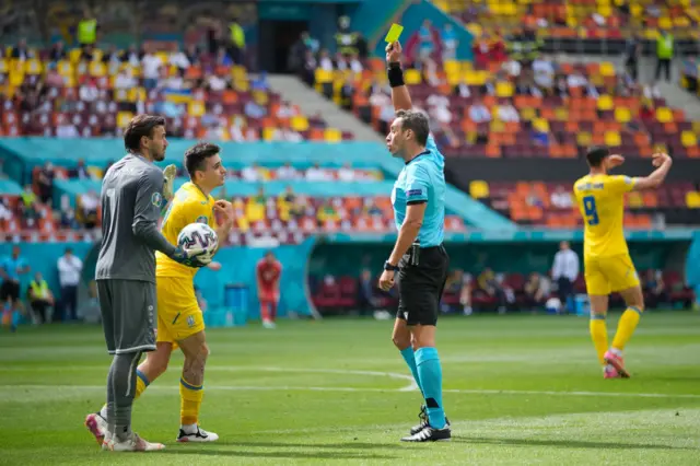 Referee gives yellow card