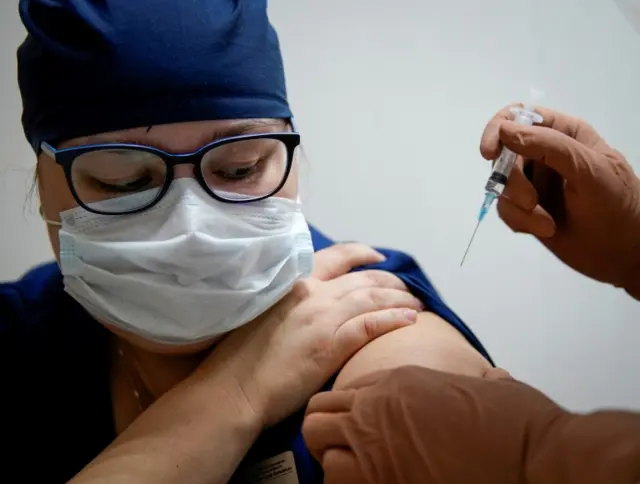 A medic of the regional hospital receives Russia's  Sputnik V vaccine in Tver, Russia, in October 2020