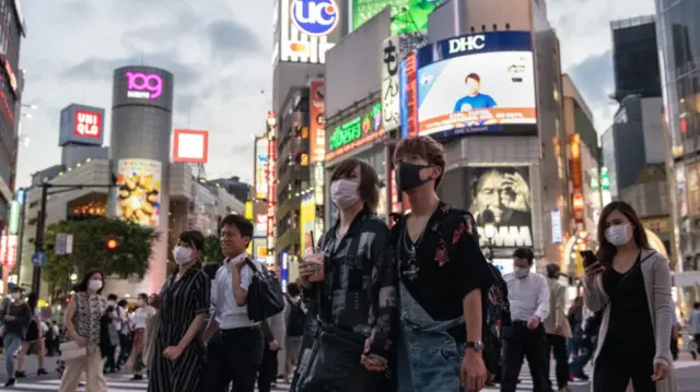 People wearing masks in Tokyo's Shibuya district