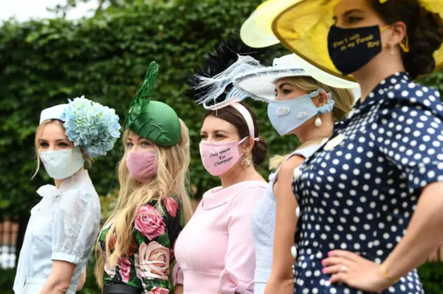 Racegoers attend the third day of the Royal Ascot horse racing meet, in Ascot, west of London on 17 June 2021