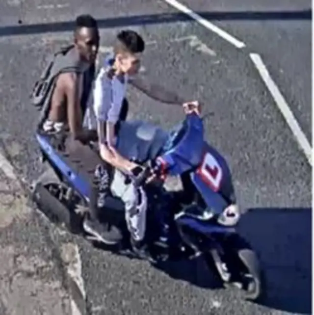 CCTV image of men on moped