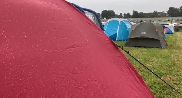 tents in the rain at Download