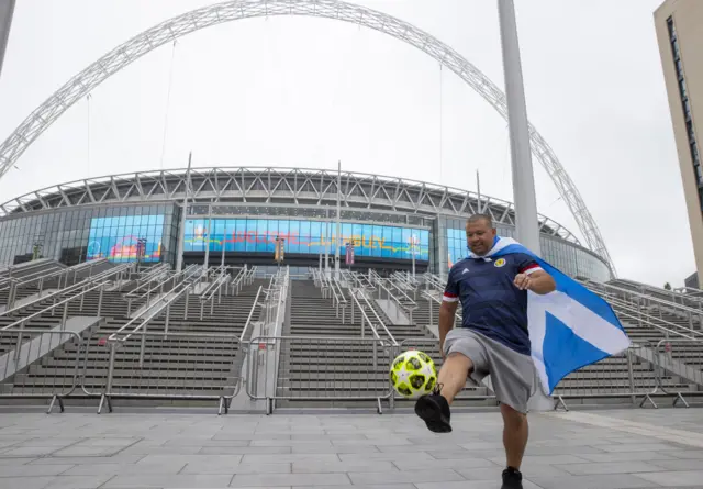 A Scotland fan enjoying a kickabout at Wembley earlier today