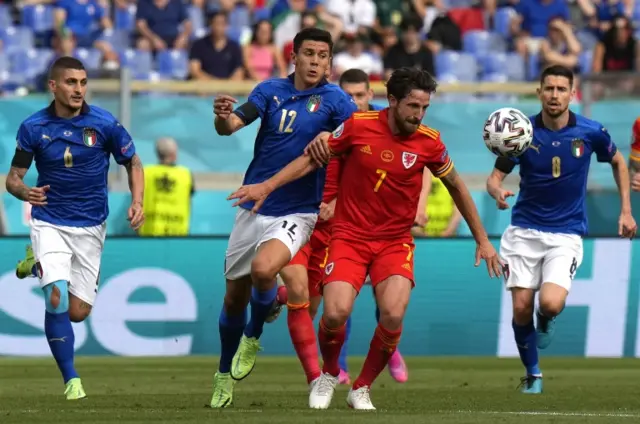 Italy's Matteo Pessina challenges Wales' Joe Allen