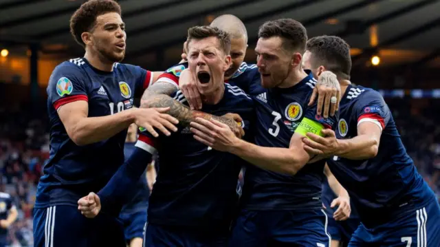 Scotland celebrate after a great strike from Callum McGregor