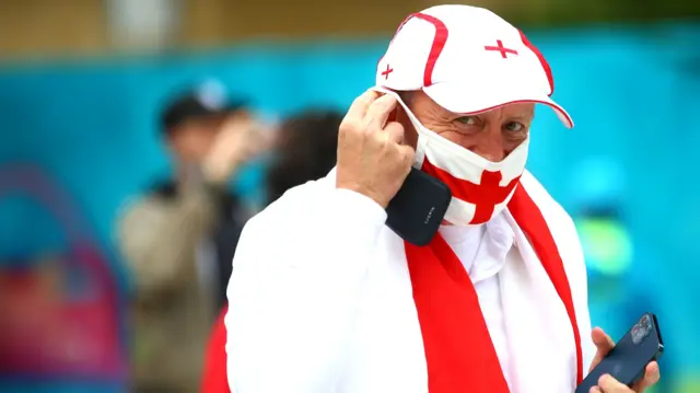 An England fan arrives at Wembley