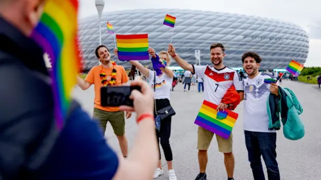 Fans with rainbow flags