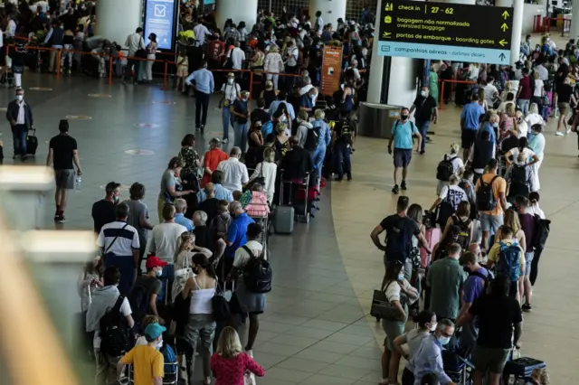 British tourists and residents line up to return to England at Faro airport, Algarve on 5 June