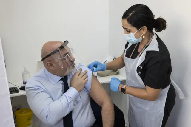 Nadhim Zahawi getting his covid vaccine in March