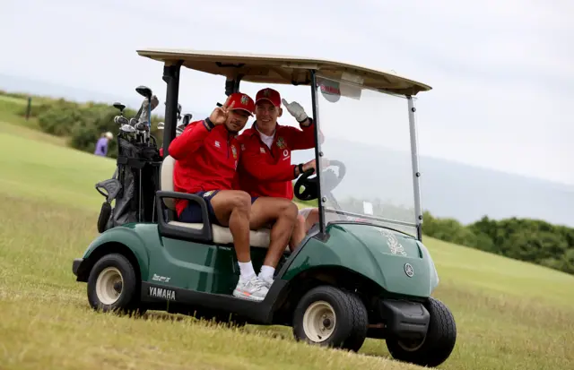 Anthony Watson and Liam Williams on a golf buggy