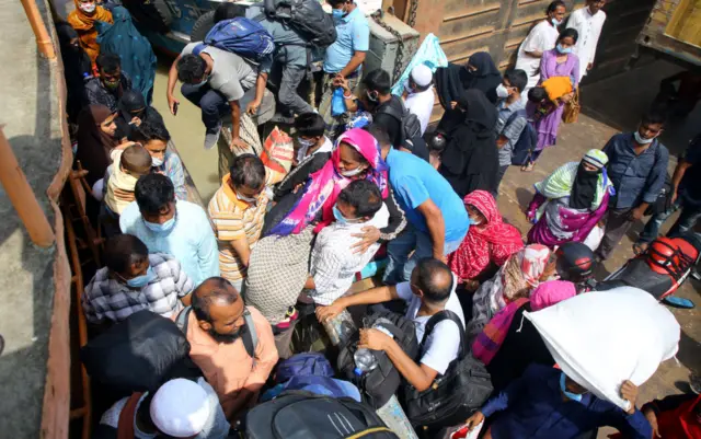 Rush of travellers at Shimulia ferry terminal in Dhaka, Bangladesh, on 26 June 2021