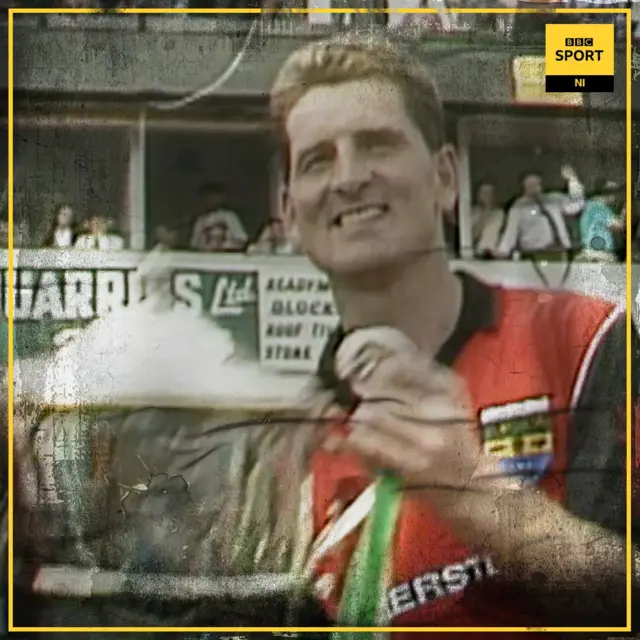 Down captain Paddy O'Rourke lifts the Anglo Celt in 1991