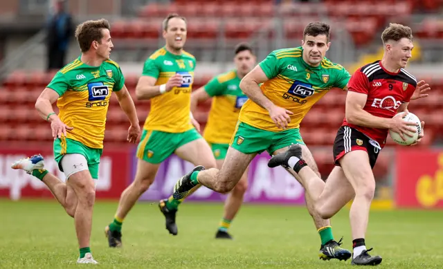 Michael Murphy (second from the left) in action at Pairc Esler before being forced off by a recurrence of his hamstring injury