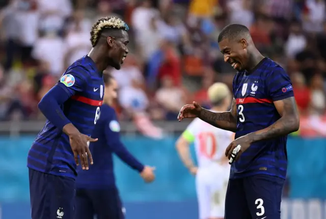 Paul Pogba celebrates with Presnel Kimpembe