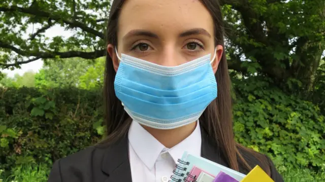 A pupil in England wearing a face mask