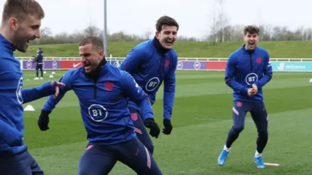 Kyle Walker (second from left), Harry Maguire (centre), John Stones (right)