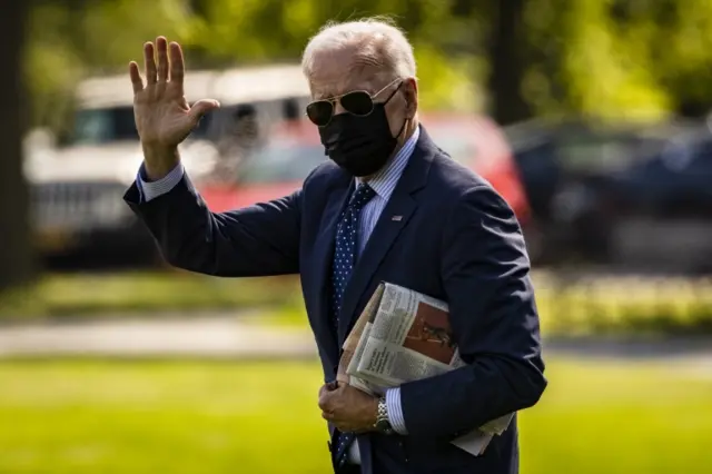 US President Joe Biden waves to members of the press corps as he walks on the Ellipse near the White House before boarding Marine One in Washington, DC, USA, on 2 June 2021