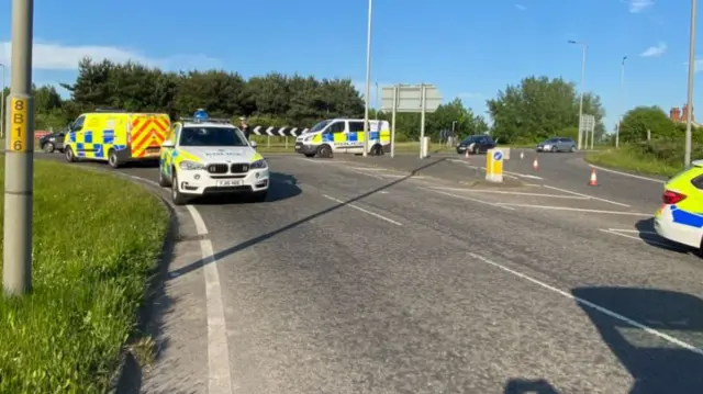 Police vehicles at crash scene