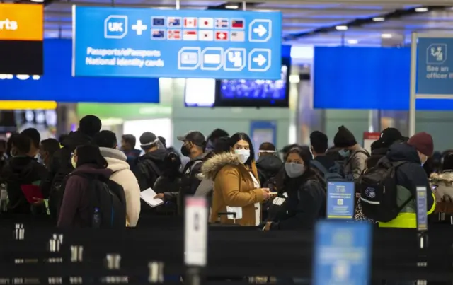 Queues at at Terminal 2 at Heathrow Airport