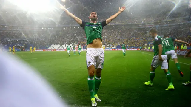 Gareth McAuley celebrates his goal