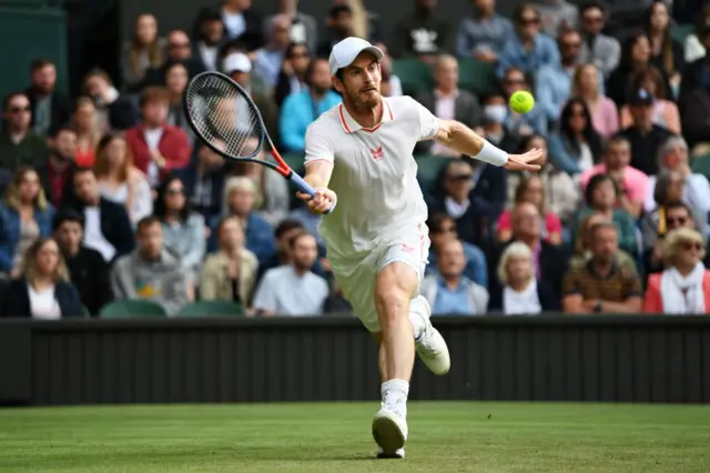 Andy Murray reaches for the ball