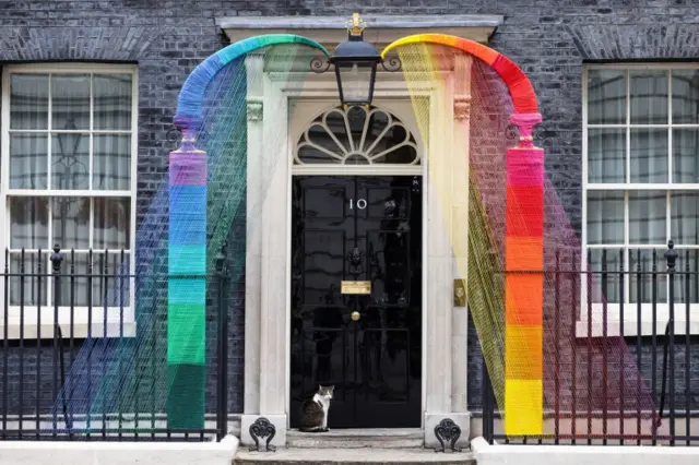 A Rainbow arch by artists Louisa Loizeau and Hattie Newman has been installed over the door at Number 10 Downing Street to mark Pride month