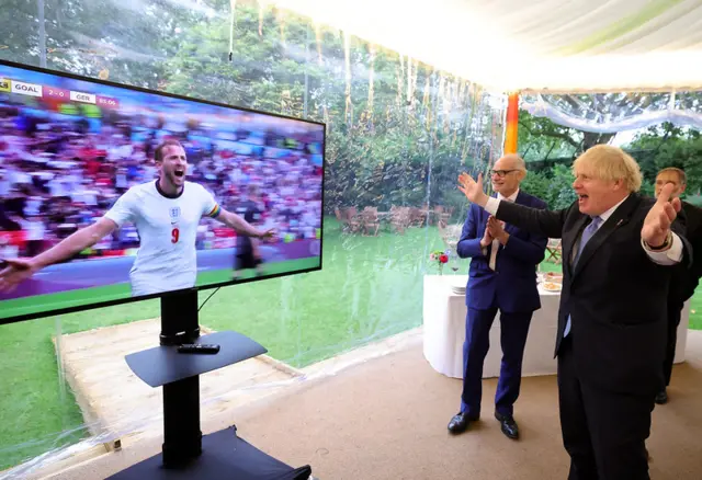 Prime Minister Boris Johnson celebrates Harry Kane's goal at Wembley, the second of the match