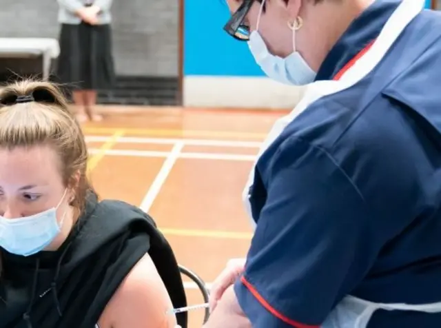 Woman being vaccinated against Covid