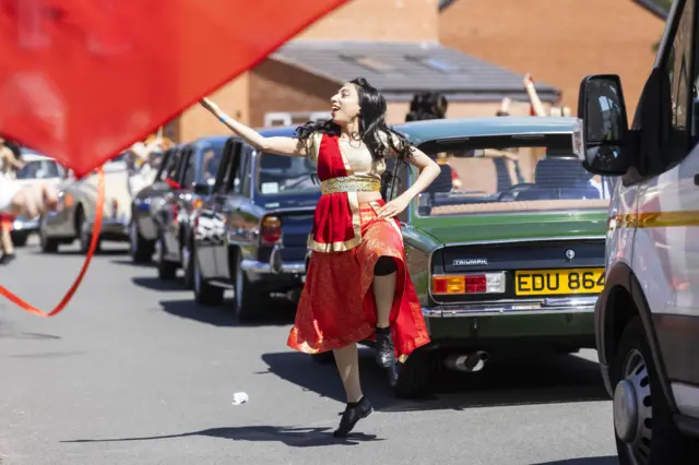 A fleet of cars built in Coventry burst with Bollywood, Caribbean and Irish dancers during Coventry Moves