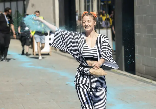 A group of Coventry"s young River Runner performers make their way through the Coventry streets as they trace the path of the river that runs beneath the city during Coventry Moves