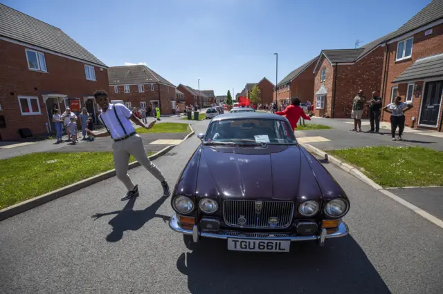 A fleet of cars built in Coventry burst with Bollywood, Caribbean and Irish dancers during Coventry Moves