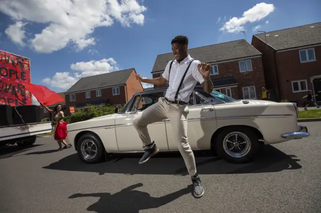 A fleet of cars built in Coventry burst with Bollywood, Caribbean and Irish dancers during Coventry Moves