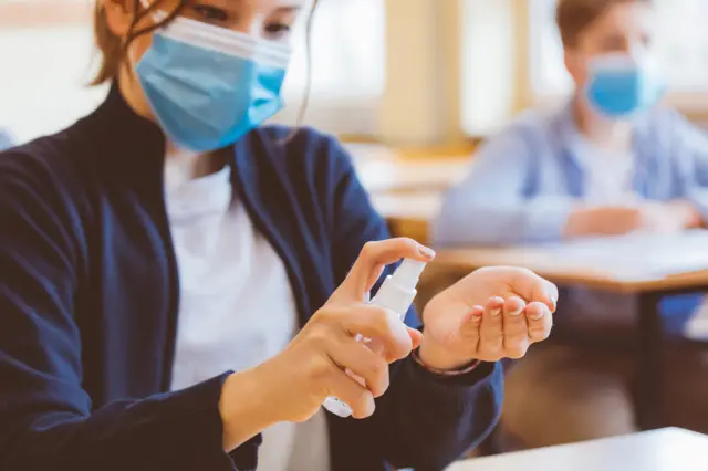 Teen wearing face mask, stock image