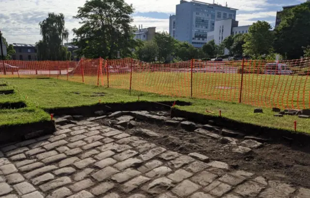 Excavated cobbled street