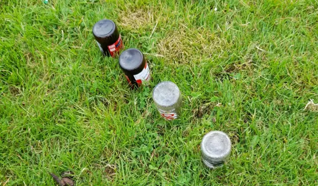 Bottles buried in ground