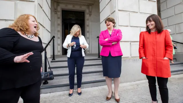 NI Justice Minister Naomi Long, Deputy First Minister Michelle O'Neill, First Minister Arlene Foster and NI Minister of Infrastructure Nichola Mallon on the steps of Stormont before a photocall.