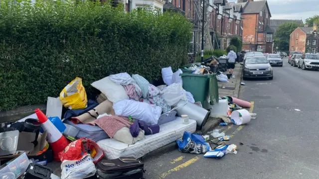 A sofa left by a street