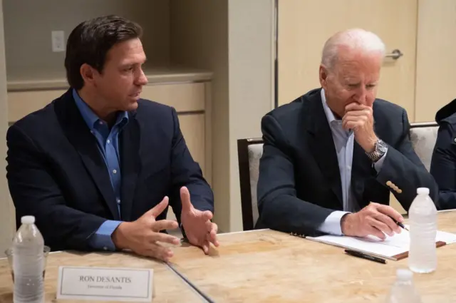 Biden, right, and Florida's Republican governor, Ron DeSantis