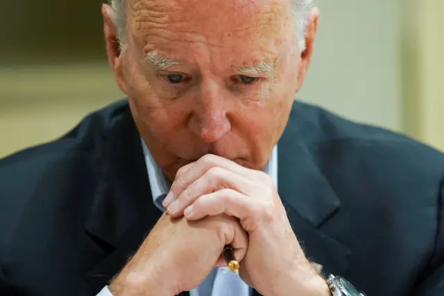 U.S. President Joe Biden listens as he is briefed about the building collapse in Surfside, in Miami, Florida U.S., July 1, 2021.