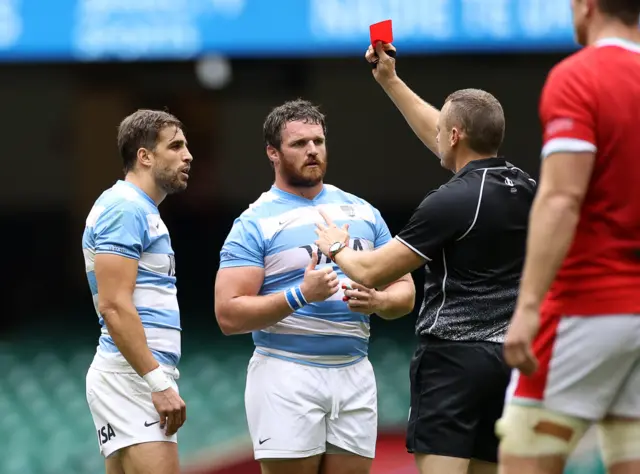 Juan Cruz Mallia of Argentina is given a red card by referee Matthew Carley