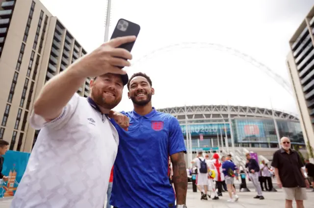 Love Island's Josh Denzel poses for pictures with fans outside Wembley Stadium