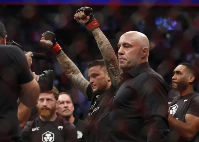 Dustin Poirier with Joe Rogan after beating Conor McGregor at UFC 264