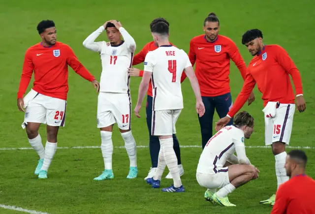 England's players lose the penalty shootout v Italy