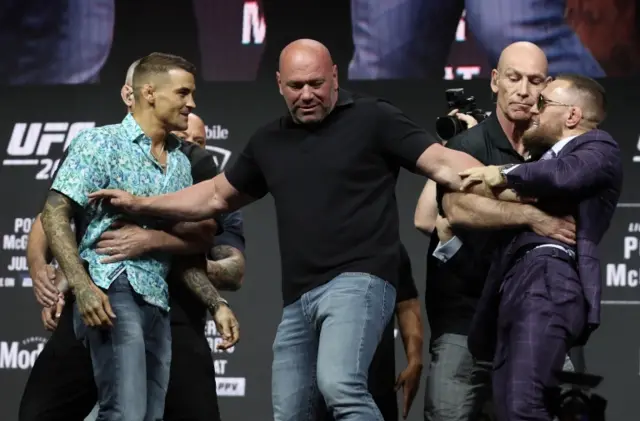 Dustin Poirier, Dana White and Conor McGregor at the pre-fight press conference for UFC 264