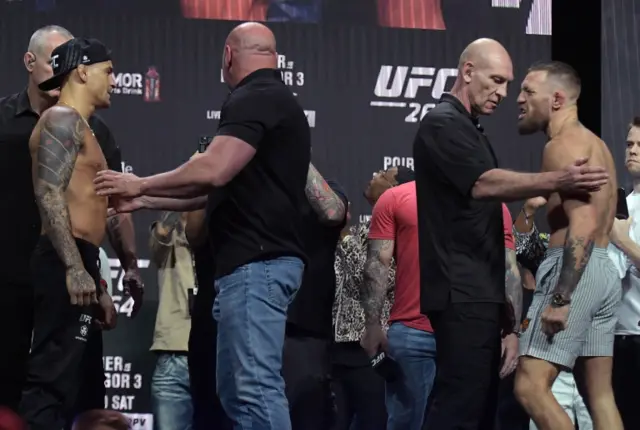 Dustin Poirier and Conor McGregor at the weigh-in for UFC 264