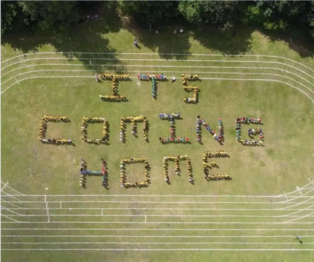 Farnborough Junior School spelling out it's coming home