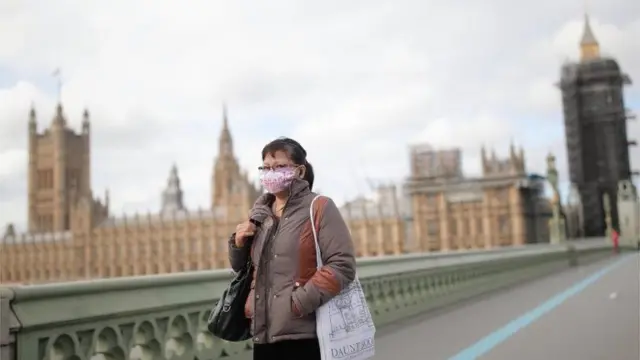 A woman with a mask by Parliament