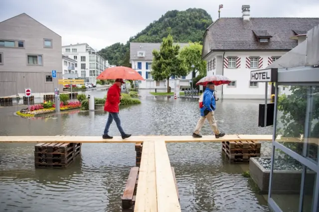 The village square of Stansstad in the canton of Nidwalden on Lake Vierwaldstaettersee is covered with flood water, in Stansstad