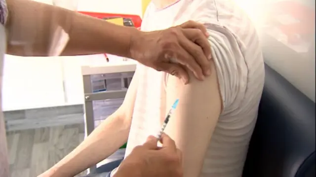 A vaccine being given