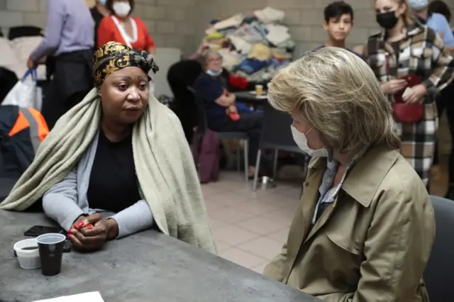 Queen Mathilde (R) of Belgium visits a crisis center for people who need shelter after flood, in Chaudfontaine,